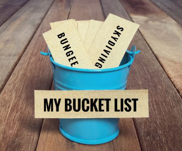Inspirational and conceptual - ‘My bucket list ‘ written on a white sticky paper. With vintage styled background.