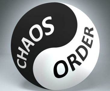 Chaos and order in balance - pictured as words Chaos, order and yin yang symbol, to show harmony between Chaos and order, 3d illustration